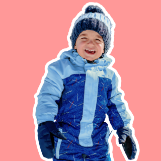 little boy in snowsuit smiling